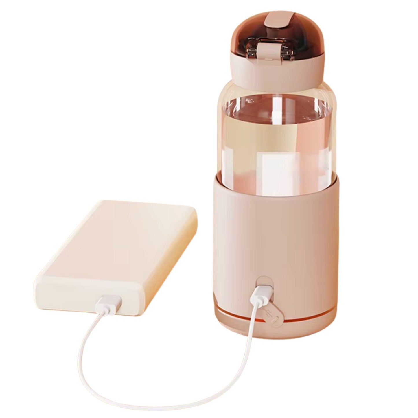 Chauffe biberon nomade rose branché à une batterie portable USB