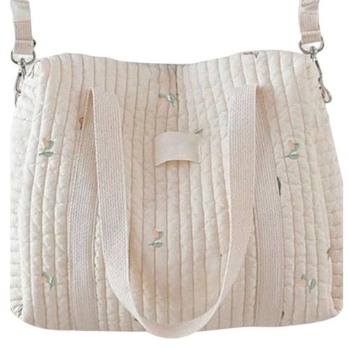 sac a langer matelassé crème à motif tulipe, avec anses beiges longues, présenté de profil