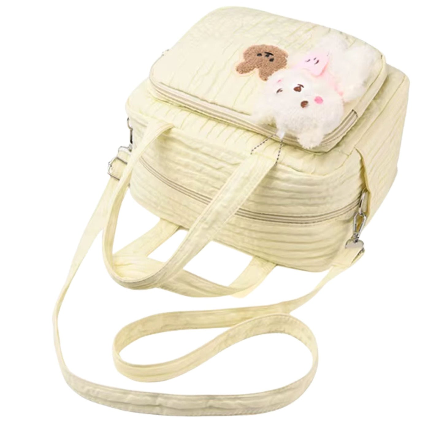 Sac a langer à motif lapin placé sur une table, avec anses verticales et format compact