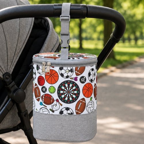 Sac pour biberons avec sangle à boucle motif ballons fixé à la poignée d’une poussette