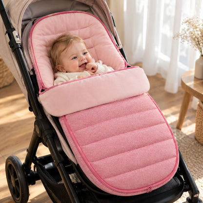 Chancelière évolutive rose avec partie avant matelassée et bébé installé