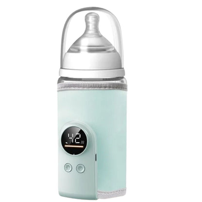 Chauffe biberon nomade vert pastel clair avec biberon installé