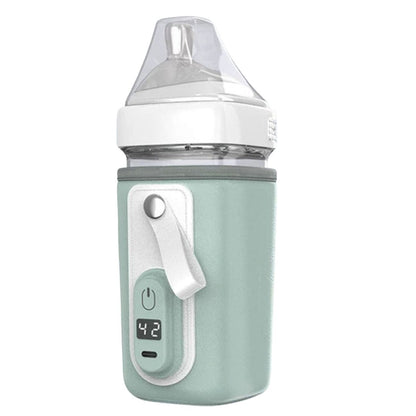 chauffe biberon nomade vert menthe pale avec écran digital allumé à 42 degrés