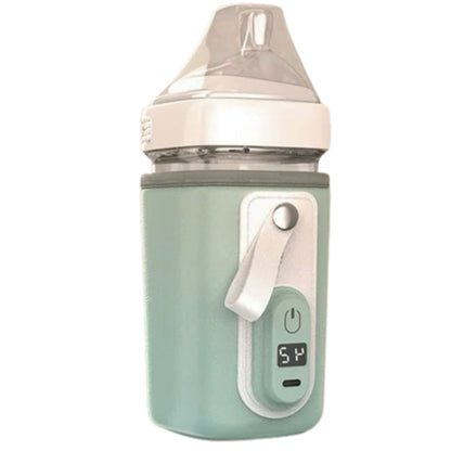 Chauffe biberon nomade vert menthe pâle avec température 54°C affichée et surface souple