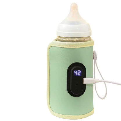 Chauffe biberon portable vert connecté en USB avec température affichée à 42 degrés