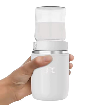 chauffe biberon usb blanc tenu en main par une personne, format compact