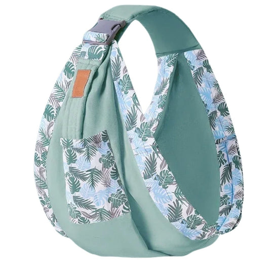 echarpe de portage vert menthe présentée vide, tissu uni vert clair avec bretelles et poche à imprimé feuillage bleu et vert