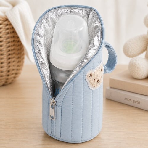 Étui matelassé pour biberon bleu ouvert avec biberon et doublure intérieure en aluminium