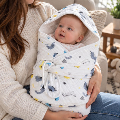 Nid d'ange gaze de coton à motifs dinosaures avec pans croisés, capuche intégrée et bandes de maintien