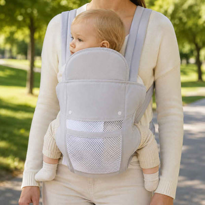 Porte-bébé 4 positions gris perle en version respirante, porté face au porteur avec panneau en maille