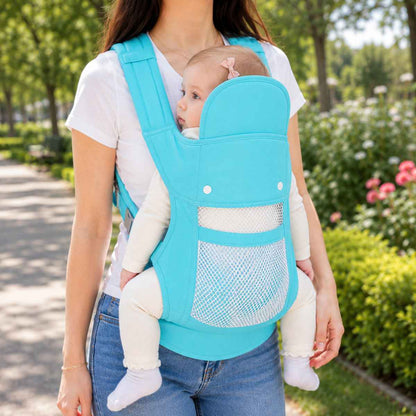 Porte-bébé 4 positions turquoise en version respirante, porté de face au parc avec panneau en maille ajourée