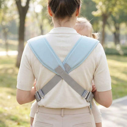Porte-bébé croisé dans le dos bleu clair, vue arrière des bretelles larges croisées en X avec sangles réglables