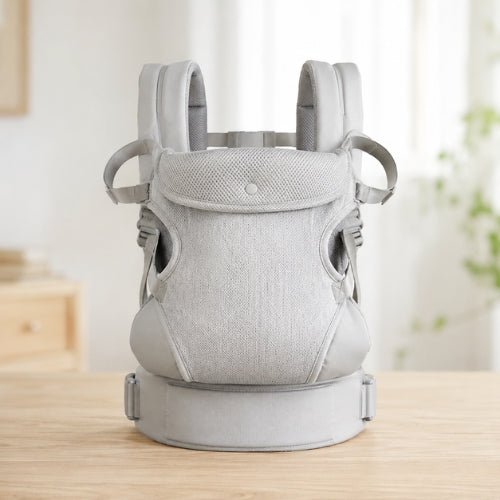 Porte bebe devant gris clair présenté seul avec maintien de tête réglable