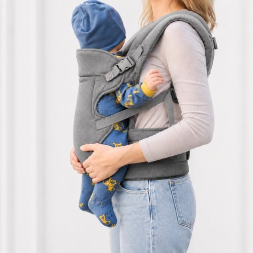 Porte bebe devant gris foncé avec maintien de tête réglable, vue de profil