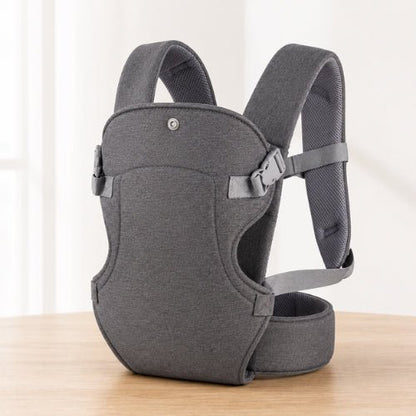 Porte bebe devant gris foncé présenté seul avec maintien de tête réglable