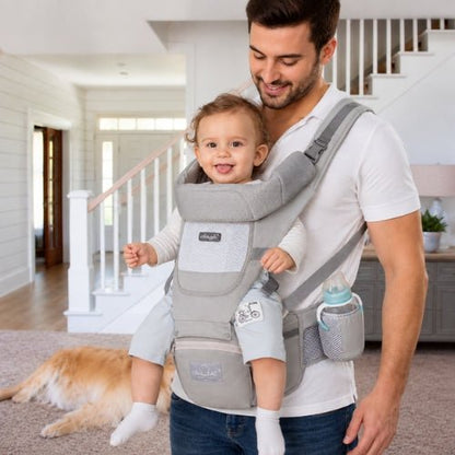 Porte bebe evolutif gris porté par un papa avec bébé en position ventrale