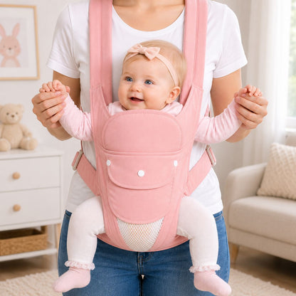 Porte-bébé multiposition rose avec panneau relevable, bébé porté face vers l’extérieur en intérieur
