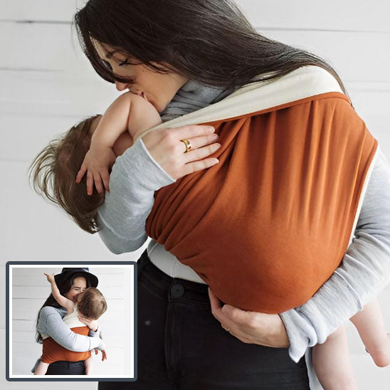 Porte bébé orange SoftCarry, pratique et ergonomique pour faciliter les déplacements quotidiens avec bébé