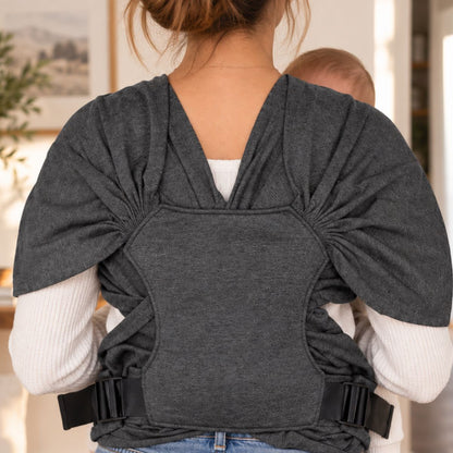 Porte-bébé sans nœud gris foncé vu de dos, avec panneau dorsal textile et sangles latérales à boucles