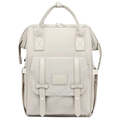 Sac à dos à langer beige avec grande poche à rabat et finitions soignées