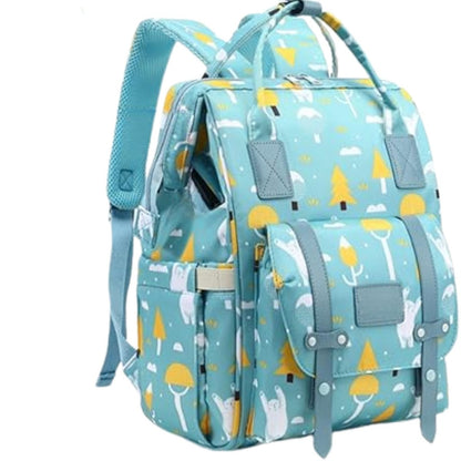 Sac à dos à langer turquoise à motifs, vu en angle avec poches latérales pratiques