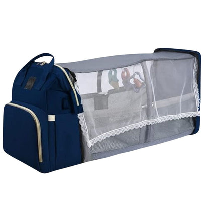 Sac à dos à langer déplié en version lit pour bébé avec barrières latérales