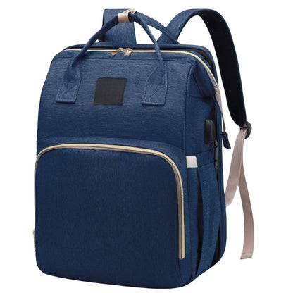 Sac à dos à langer en vue frontale avec poignée supérieure et format compact