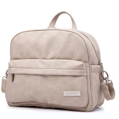 sac a langer gris pierre vue de face posé sur fond blanc