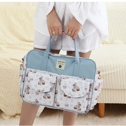Sac a langer chic lapin de Pâques porté à la main, accessoire raffiné et pratique