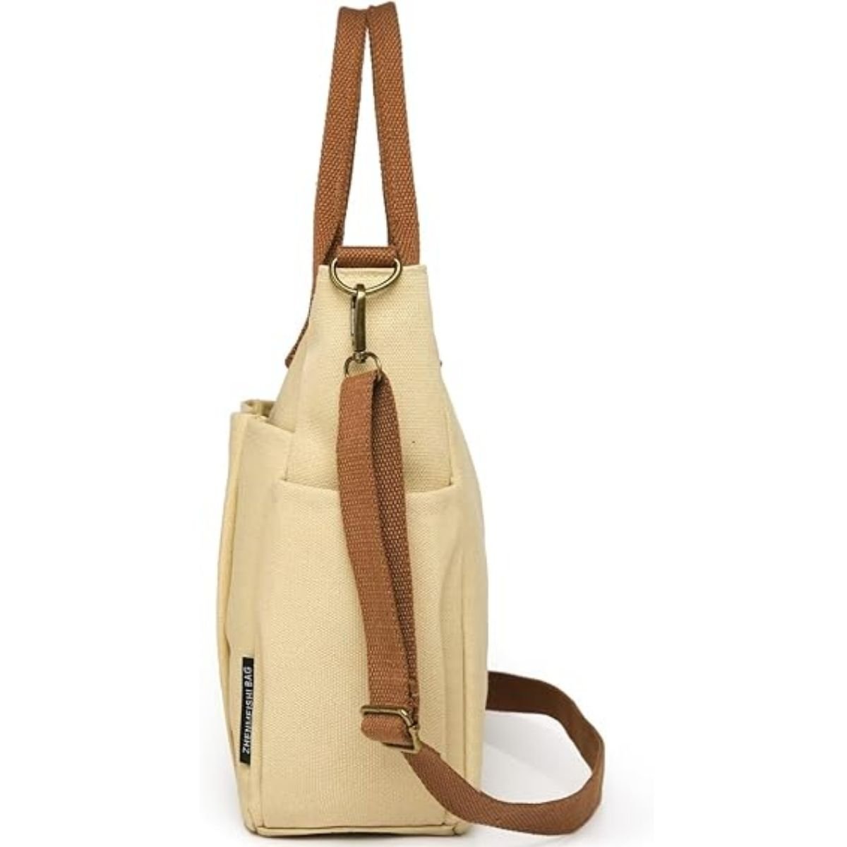 Sac a langer compact kaki vu de côté avec bandoulière réglable et poche latérale pratique