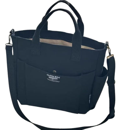 sac a langer femme compact noir en toile rigide avec bandoulière