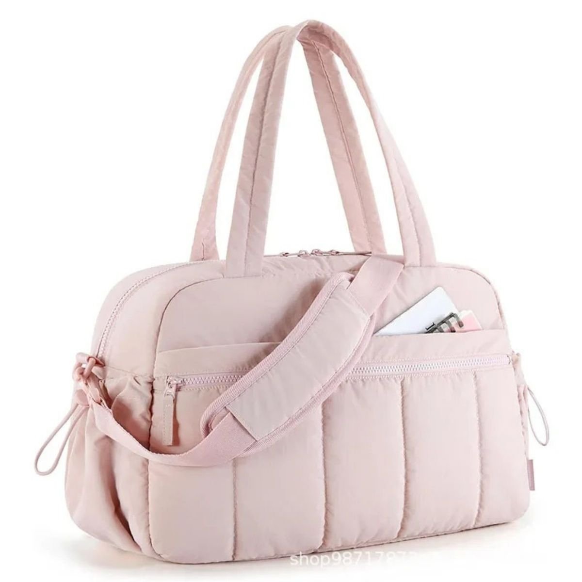 Sac a langer multifonction couleur rose en vue latérale