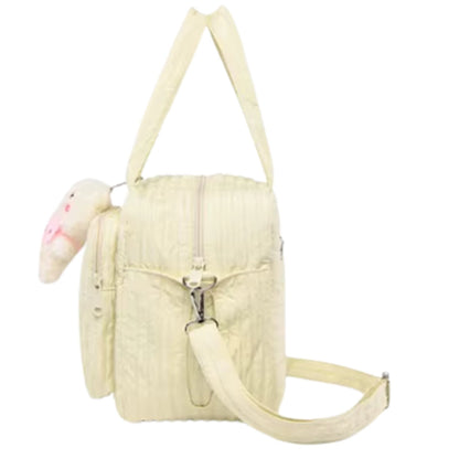 Sac a langer jaune décoré d’un motif lapin sur le devant