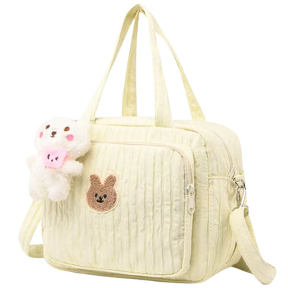 Vue latérale du sac a langer avec imprimé lapin et poche extérieure zippée