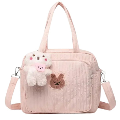 Sac a langer rose avec illustration lapin et rabat souple, parfait pour les sorties bébé