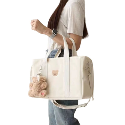 Sac a langer à motif ourson, équipé de double poignée et d’un porte-clé