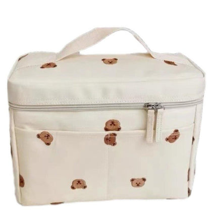 Sac a langer vu de face avec poignée supérieure et poche avant zippée