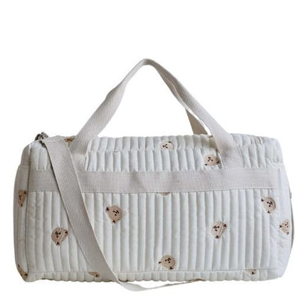 vue arriere du sac a langer avec petits ours imprimes et bandouliere claire