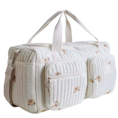 sac a langer creme avec petits ours imprimes vu en perspective laterale