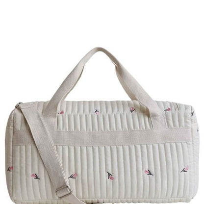 vue arriere du sac a langer tulipe brodee avec bandouliere creme