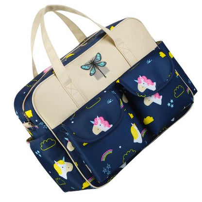  sac bebe motif licorne bleu nuit vu en biais avec anses creme et poches avant