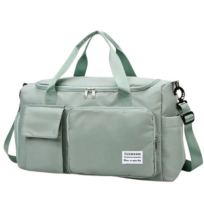 Sac maternité vert clair avec poches avant et bandoulière réglable