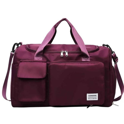 Sac maternité violet foncé avec poches frontales, vue de face