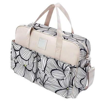 sac pour bebe avec motif floral noir et blanc vu de dos