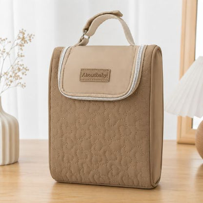 Sac pour deux biberons marron avec bandes élastiques de maintien et poignée intégrée, vue de face